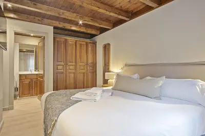 Cama o camas de una habitación en Luderna - Dúplex Val de Ruda C1 de Carlac