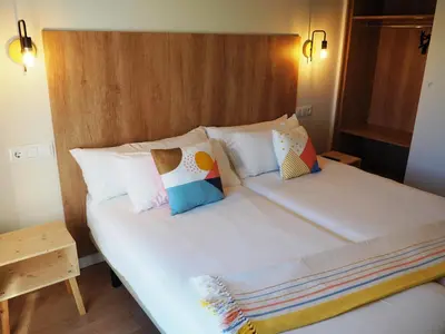 Cama o camas de una habitación en Apartamento Vive Ainsa
