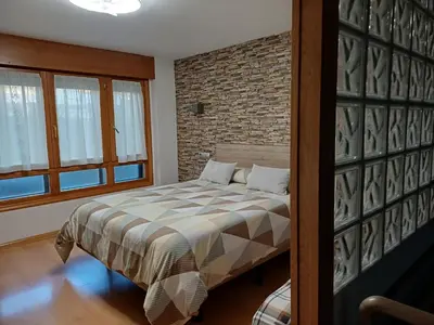 Cama o camas de una habitación en Apartamento Puerta del Pirineo