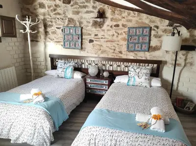 Cama o camas de una habitación en Casa Rural 