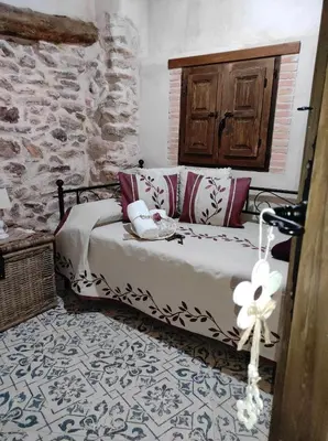 Cama o camas de una habitación en Casa Rural 