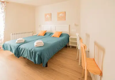Cama o camas de una habitación en Preciosa casa para familias y grupos en Navarra