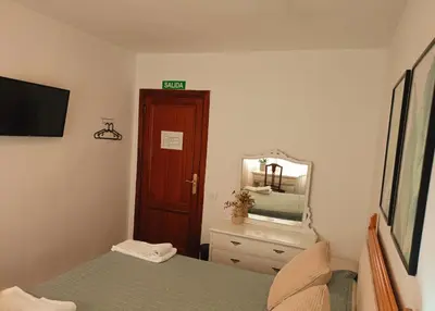Cama o camas de una habitación en Pensión las Hojas
