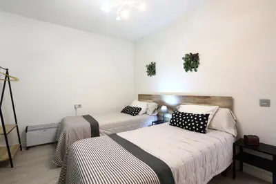 Cama o camas de una habitación en Atico la casa de Tudela