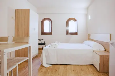 Cama o camas de una habitación en Apartamentos Ducay