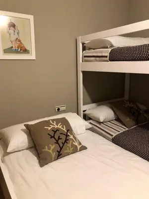 Cama o camas de una habitación en Acogedor apartamento en el corazón del Valle