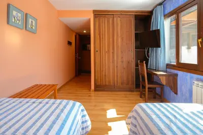 Cama o camas de una habitación en HOTEL TURPÍ