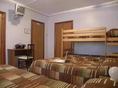 Cama o camas de una habitación en Hostal Oasis