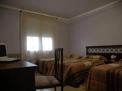Cama o camas de una habitación en Hostal Oasis