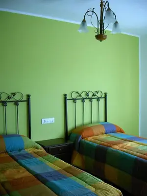 Cama o camas de una habitación en Apartamentos Arcos de Solana