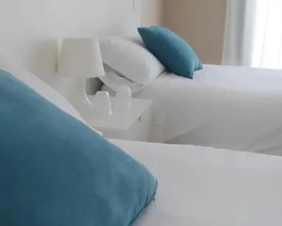 Cama o camas de una habitación en Hostal La Placeta