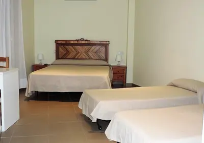 Cama o camas de una habitación en Hostal La Placeta