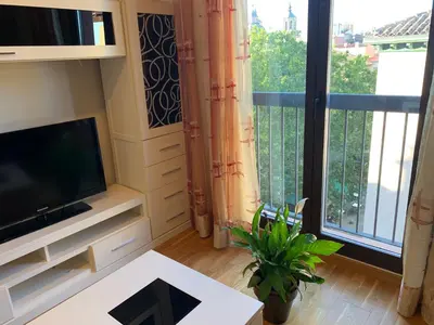 Una televisión o centro de entretenimiento en Cozy apartment Plaza del Pilar - San Felipe
