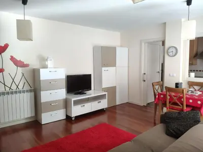 Una televisión o centro de entretenimiento en Las Margas Golf + Pirineo Aragonés