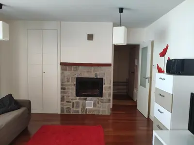 Una televisión o centro de entretenimiento en Las Margas Golf + Pirineo Aragonés