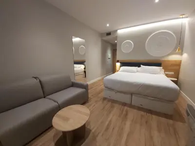 Cama o camas de una habitación en Habital Suites