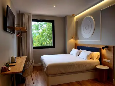 Cama o camas de una habitación en Habital Suites