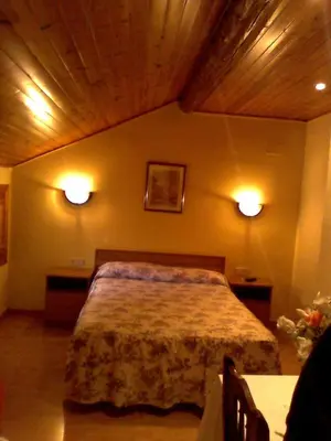 Cama o camas de una habitación en Hostal Can Josep