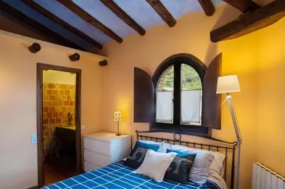 Cama o camas de una habitación en Albergue Rural de Guara