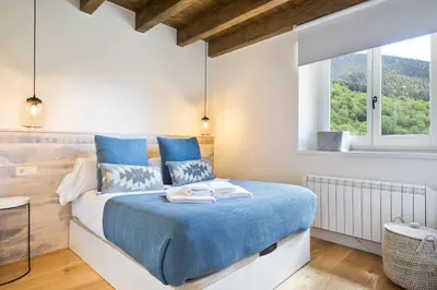 Cama o camas de una habitación en Luderna - Dúplex con jardín des Treuetes
