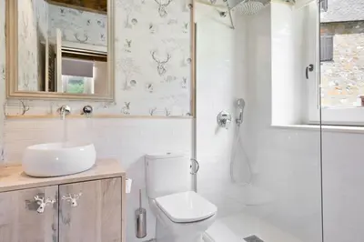 Un baño de Luderna - Dúplex con jardín des Treuetes