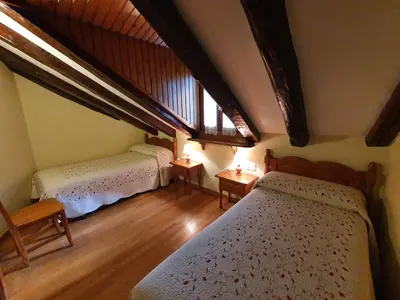 Cama o camas de una habitación en Casa Duplex La Buhardilla