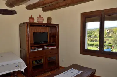 Una televisión o centro de entretenimiento en Apartamento Vivienda Sampietro