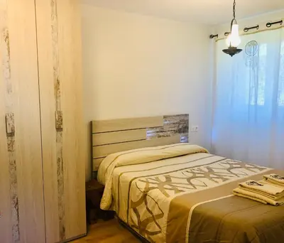 Cama o camas de una habitación en Apartamentos Zabalarena Artzaia