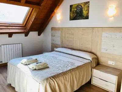 Cama o camas de una habitación en Apartamentos Zabalarena Basoa