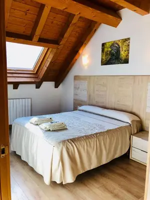 Cama o camas de una habitación en Apartamentos Zabalarena Basoa
