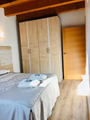 Cama o camas de una habitación en Apartamentos Zabalarena Basoa