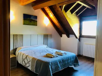 Cama o camas de una habitación en Apartamentos Zabalarena Basoa