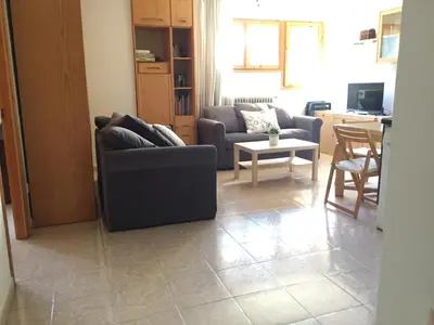 Zona de estar de Atico en Biescas con Piscina, Tenis y Barbacoa
