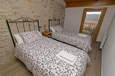 Cama o camas de una habitación en La Bodega de Puy
