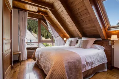 Cama o camas de una habitación en TAMARRO de Alma de Nieve