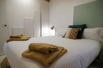 Cama o camas de una habitación en Silken Casa Platerias Siglo XV