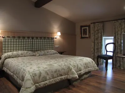 Cama o camas de una habitación en Hostal Beti-jai