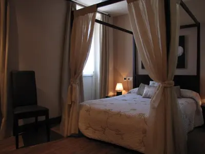 Cama o camas de una habitación en Hostal Beti-jai