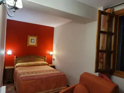 Cama o camas de una habitación en Apartamentos Casa Español