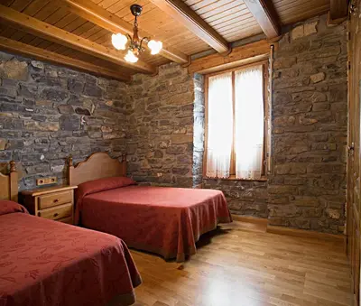 Cama o camas de una habitación en Apartamentos Casa Buisan