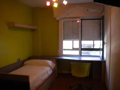Cama o camas de una habitación en Pensión Room Pamplona
