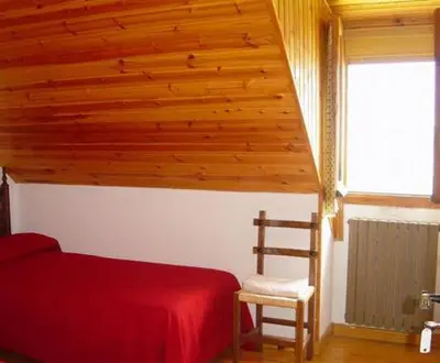 Cama o camas de una habitación en Pensión Pallaruelo