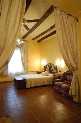 Cama o camas de una habitación en Hotel SPA Don Iñigo de Aragón