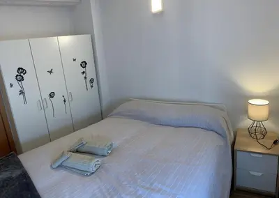 Cama o camas de una habitación en APARTAMENTS IMPRO