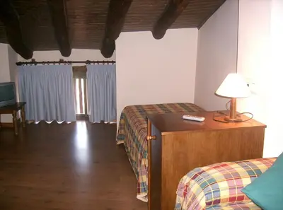 Cama o camas de una habitación en Casa Rural Benito