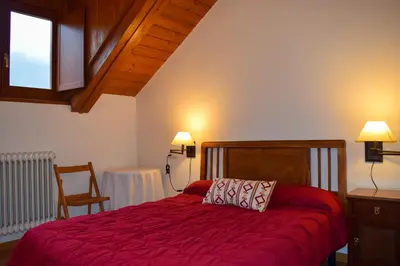 Cama o camas de una habitación en Duplex con vistas en Benasque