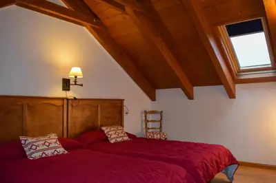 Cama o camas de una habitación en Duplex con vistas en Benasque