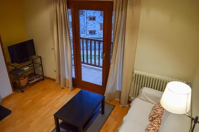 Cama o camas de una habitación en Duplex con vistas en Benasque