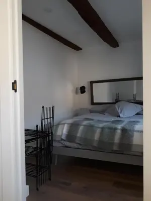 Cama o camas de una habitación en Plaza Catedral Jaca