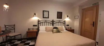 Cama o camas de una habitación en Hostal El Lechuguero